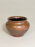 Small copper and green ceramic vase