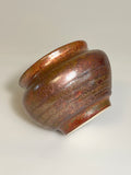 Small copper and green ceramic vase