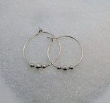Silver hoops with beads